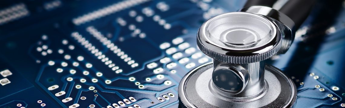 Medical stethoscope on the blue printed circuit board. Repair diagnostic fixing electronic concept