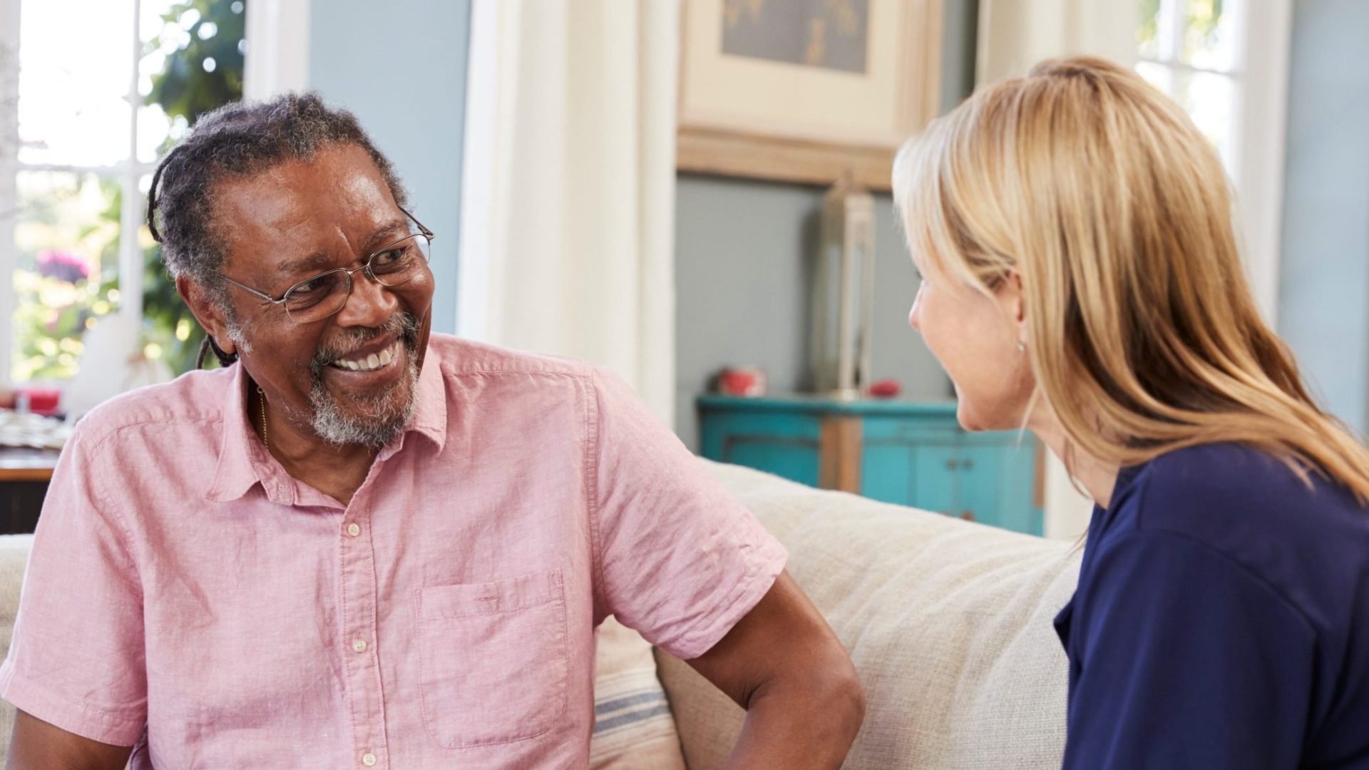 Female Support Worker Visits Senior Man At Home